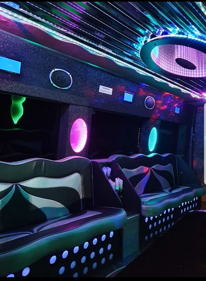 multicoloured led lights interior of party bus